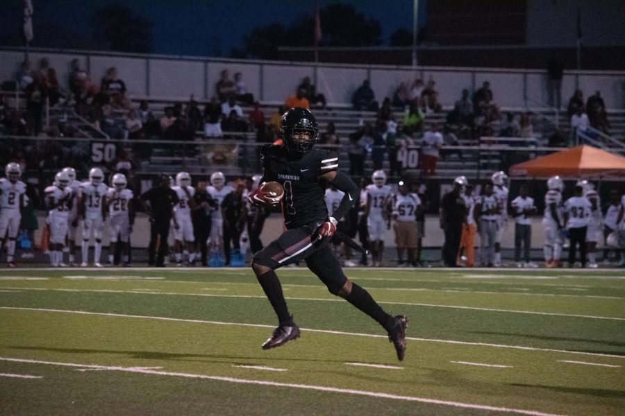 Senior Jaylin Chambers runs for a touchdown after catching a Viking punt. His touchdown put the Senators up 14-0 in the second quarter. 