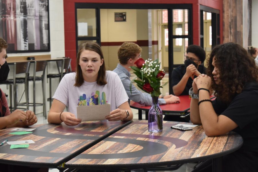 The new student program members meet in the cafeteria. Senior Emily Centamore Introduces herself to the new students she will be guiding.