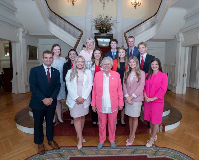 The 2022 interns pose with Gov. Kay Ivey. 