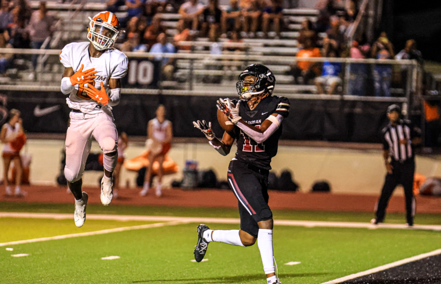 Taking the ball across the finish line, senior Karmelo Montgomery scores his second touchdown of the evening. The team routed the TIgers in the second area game of the season.