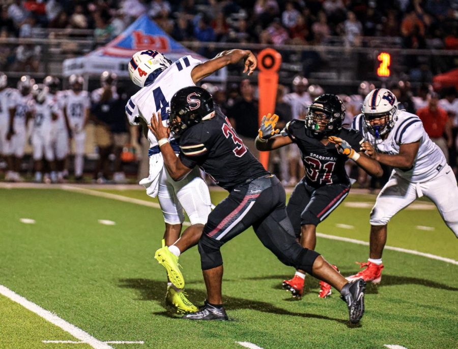 The Senators make their way to stop Bob Jones from making a pass.