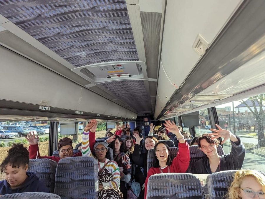 Members of the Crimson Crier staff show off their awards before the bus takes off from UAs campus following the annual ASPA state convention. 