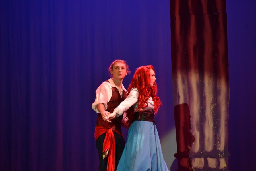 Doing a dance on stage, seniors Hunter Alexander and Kat Henderson portray their characters in the SHS Theater production of The Little Mermaid. 