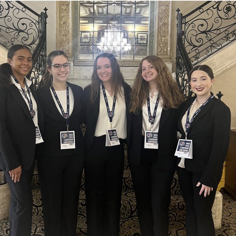 Members of HOSA gather together to pose for a group photo.