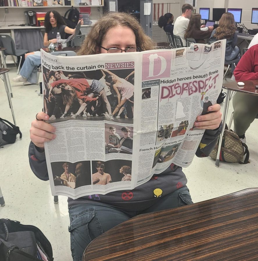 Crimson Crier staff member Neal Elliott reads a newspaper from James Bowie high school. Printing The Huntsville Times and Birmingham News have ceased, leaving those who love newsprint disappointed. 