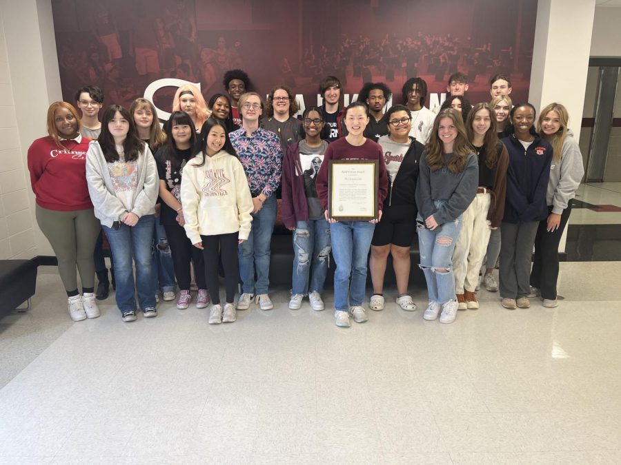 The Crimson Crier staff gathers to pose with their Gold Crown award.