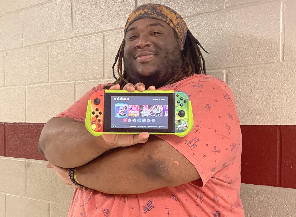 E-Sports coach Mr.Heller shows off his Nintendo switch. The addition of new games to compete in livened up the activities of the E-sport team members.