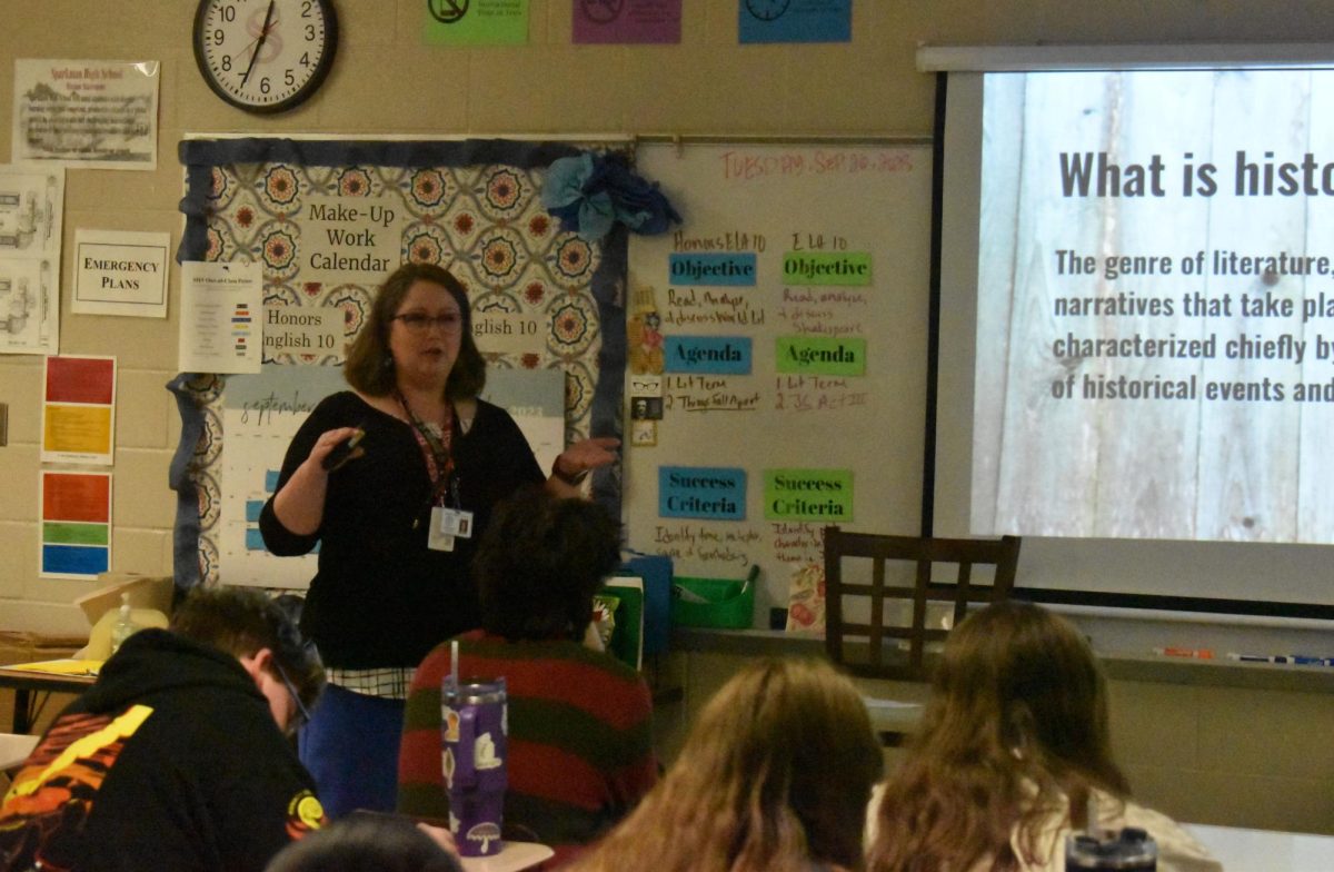 Mrs. Renee Quaife talks with her students about the elements of creative writing.