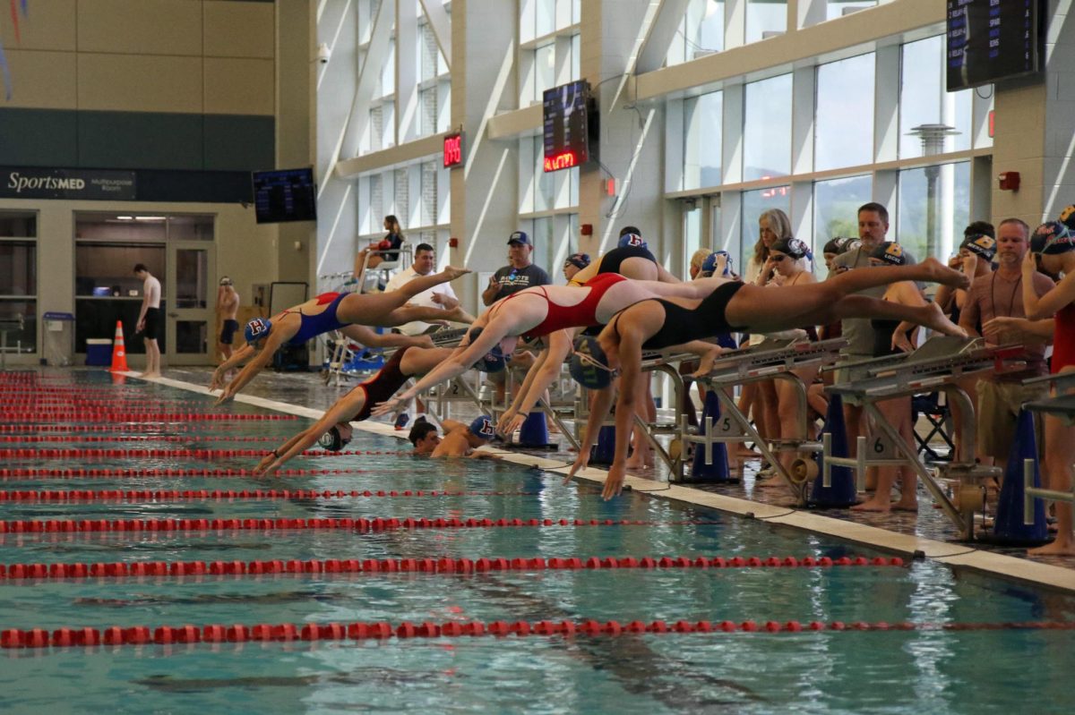 The womens team leaves the blocks to begin their first meet of the season. 