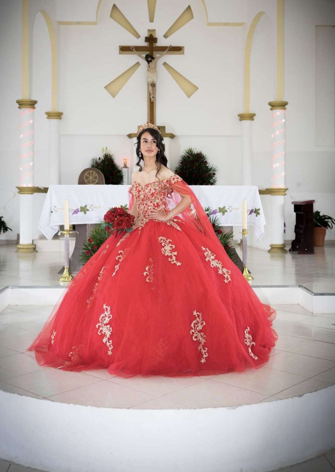 Showing off her dress, sophomore Ryann Petraszewsky poses at her quinceañera.