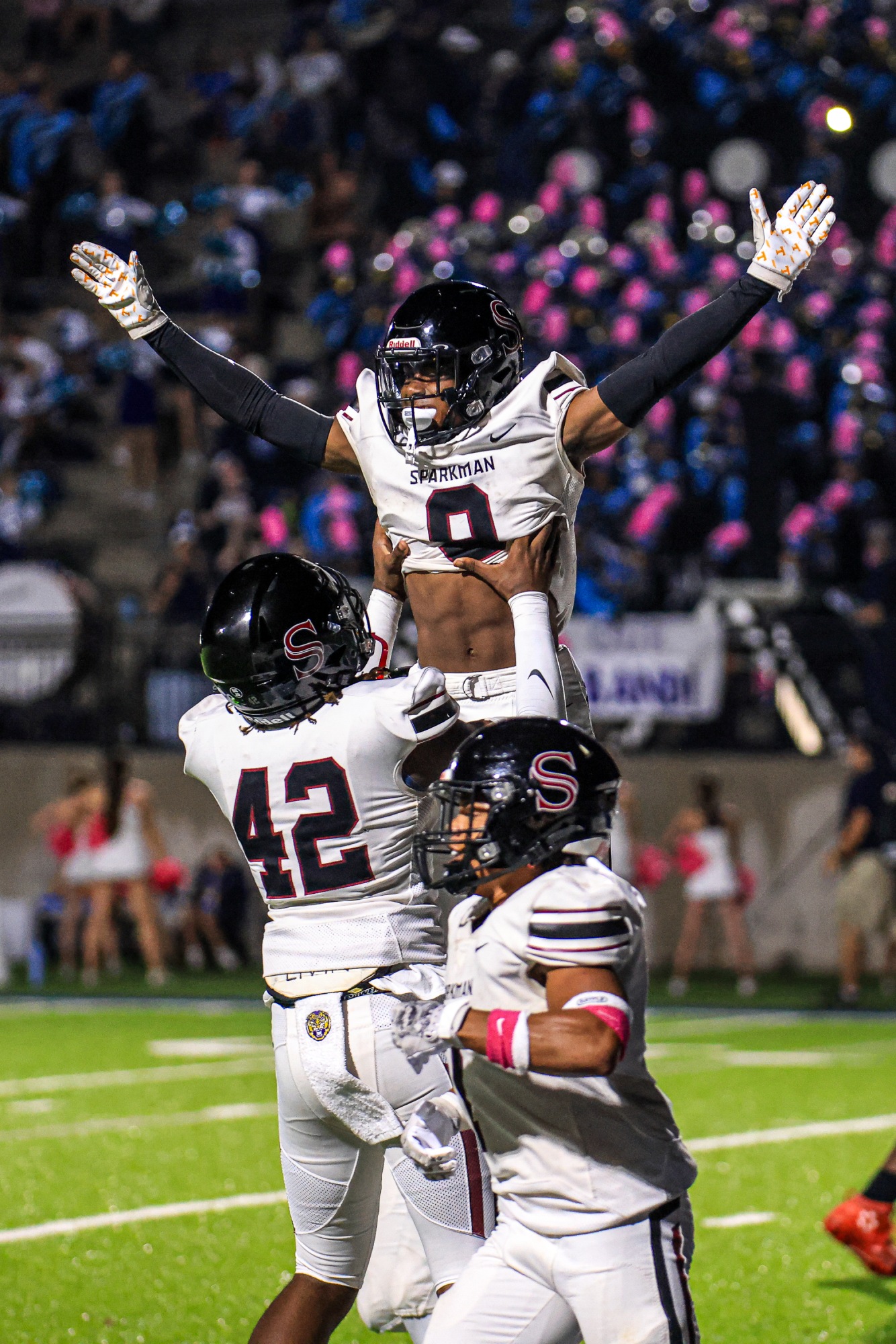 Senior Amaree Jabarr being lifted in celebration by Jamarion Matthews after first touchdown