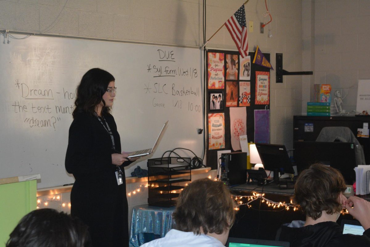 English teacher MaryAlyssa Kummer stands in front of her class giving them directions for an assignment. 