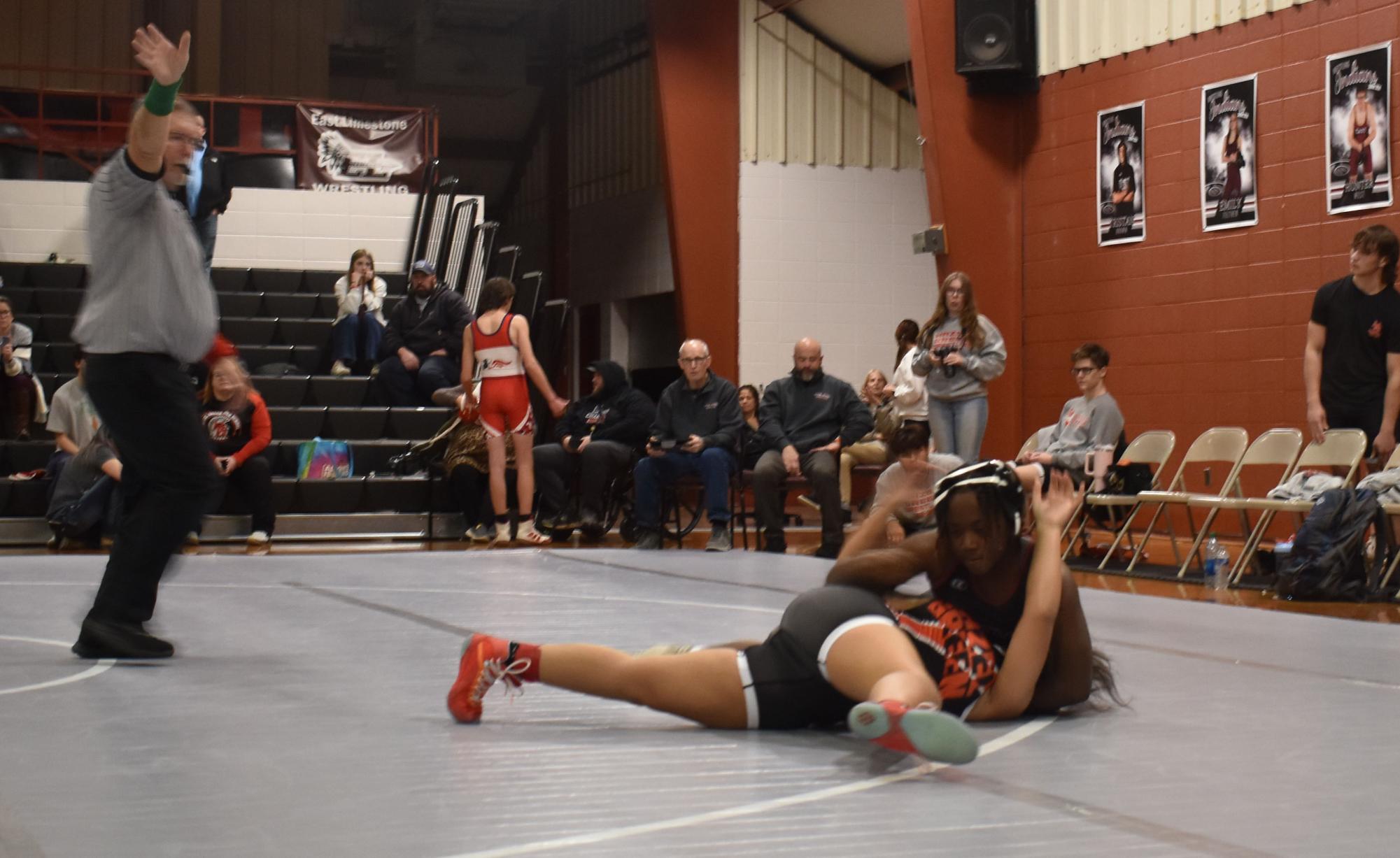 Pinning her Hazel Green opponent, junior Jessica Cooks wins the match. Cooks success of this year has her ranked in the state. 