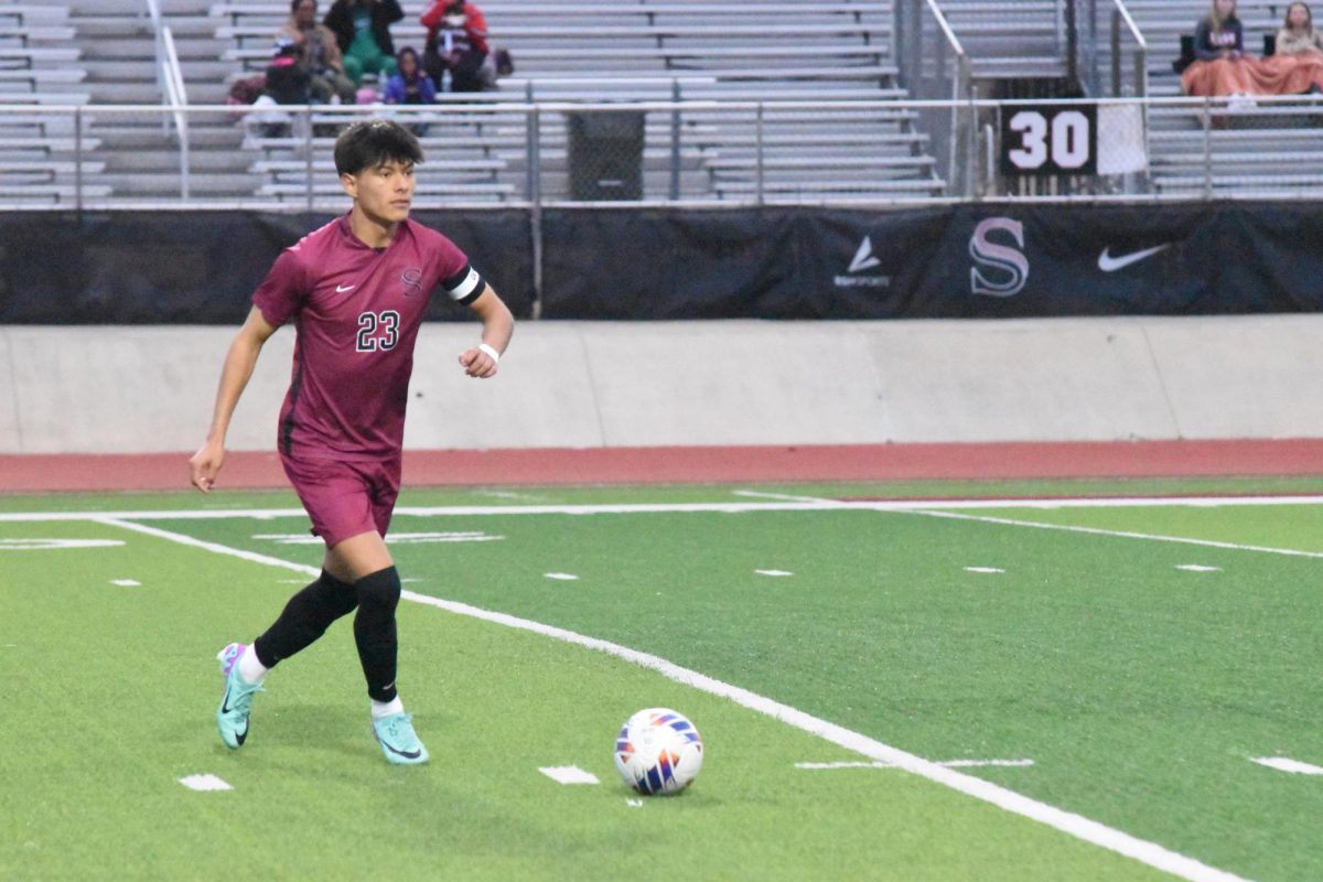 Senior Brandon Matias moves the ball up field in a recent home game against Bob Jones. 