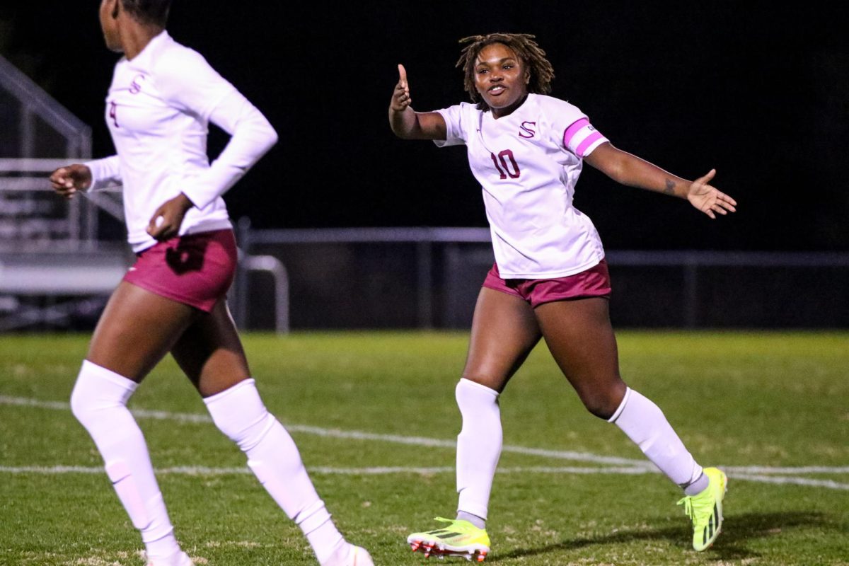 Senior Amiyah Baker directs traffic on the field during the teams game against Bob Jones. Bakers experience led to her being captain this season.