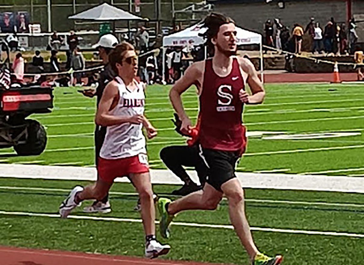 Running the first half of the mile, senior Wyatt Harris edges out an opponent. 