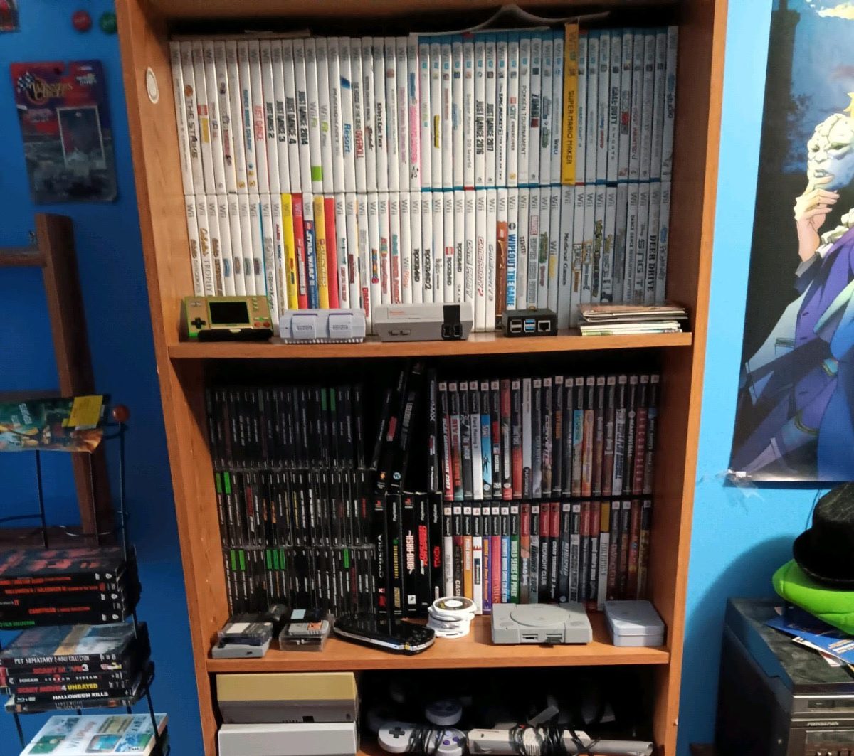 Senior Wyatt Harris stores his vast collection of video games and consoles in a bookshelf in his bedroom. 