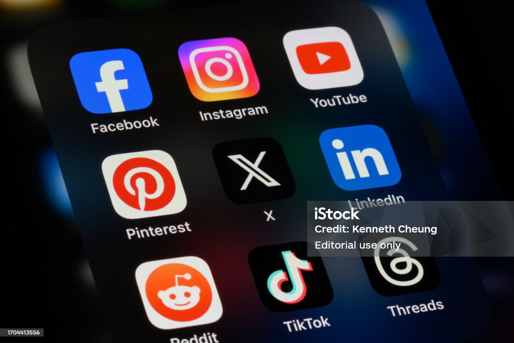 Toronto, Canada - September 24, 2023:  Popular social media apps on an Apple iPhone: Facebook, Instagram, YouTube, Pinterest, X (formerly Twitter), LinkedIn, Reddit, TikTok, and Threads.